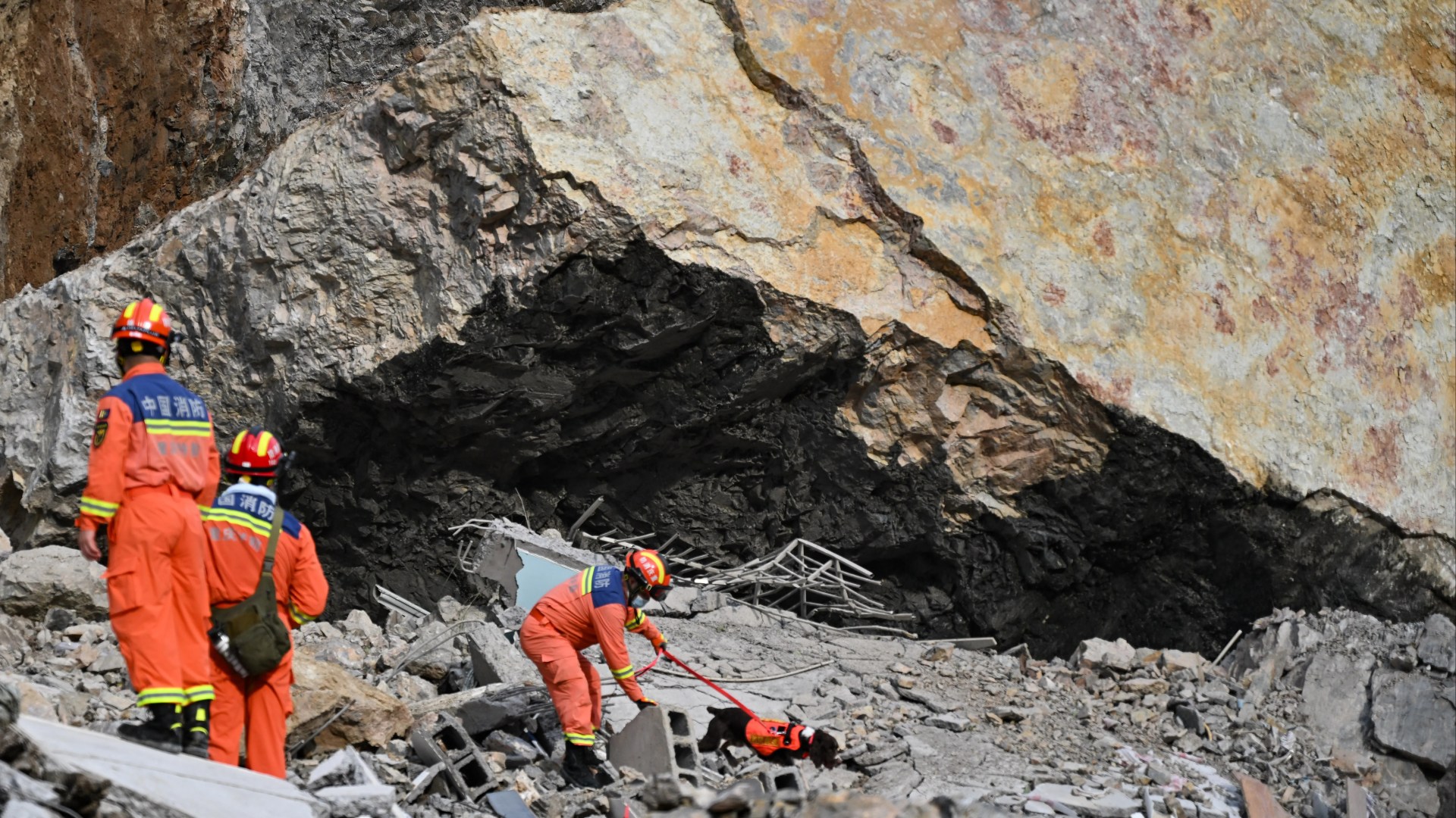 Race against time to find dozens of locals trapped under rubble after terrifying landslide in China left at least 8 dead