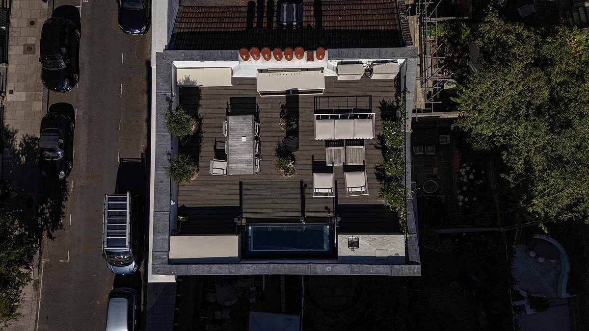 Privacy row erupts after wealthy owner illegally builds roof terrace on top of £5.75million Primrose Hill townhouse - leaving strangers to peer into their bathrooms and bedrooms