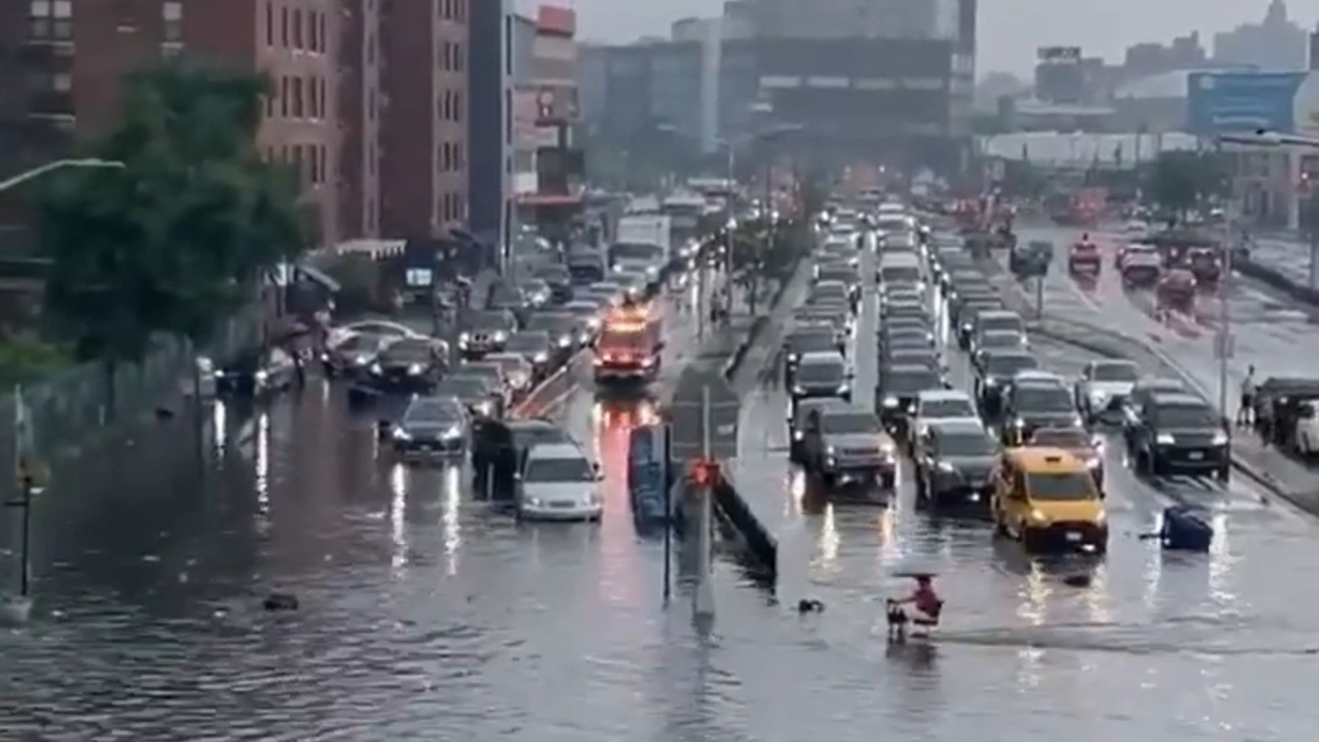 Severe flash flooding and thunderstorms batter NYC leaving cars and streets submerged just hours before World Cup final