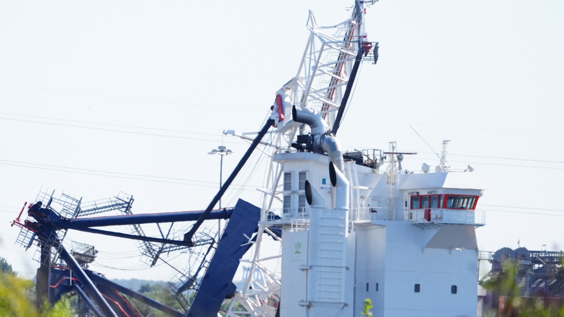 Person rushed to hospital as dockside crane collapses onto ship at major port