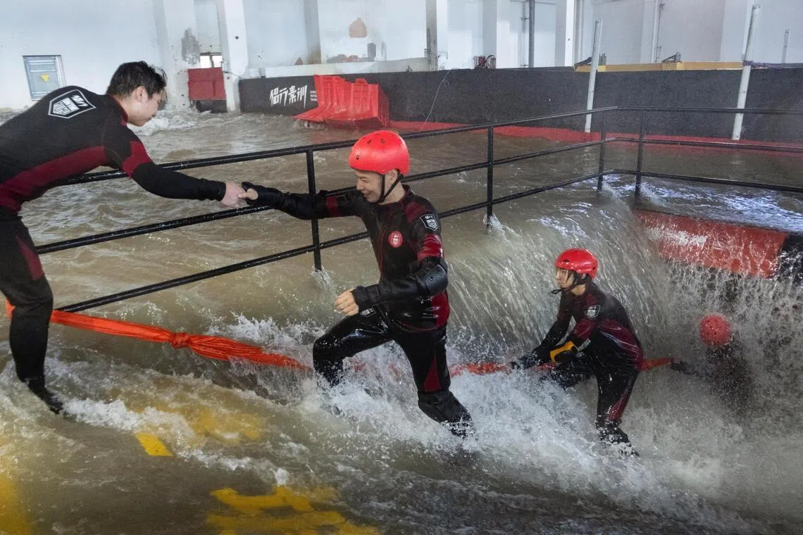 In China, people brave simulated typhoons to prepare for the real thing